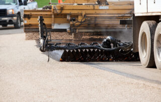 Seal Coating and Chip Sealing Asphalt Pavement Street