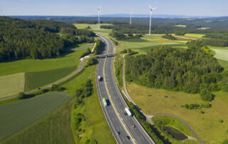 Multilane highway experiencing high traffic where it is beneficial to extend asphalt lifespan by using sustainable bitumen additives to improve performance and durability.