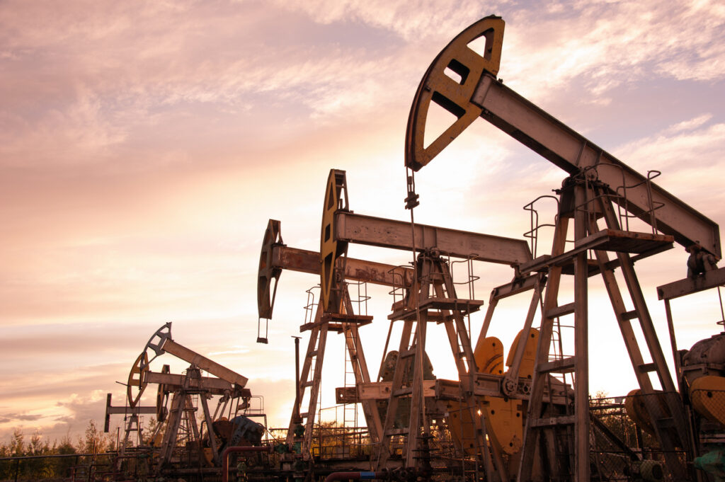 Oil pumpjacks in an oil field extracting crude oil.