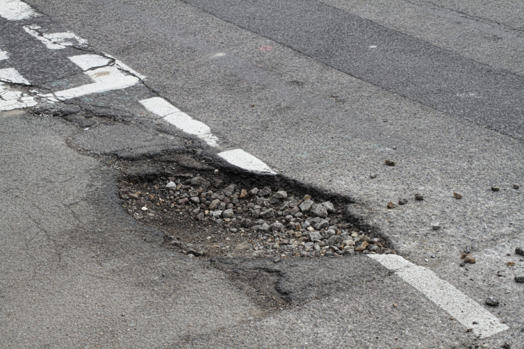 Bad repair pothole in road T-junction suffers frost damage Sripath offers additives that can be used in a variety of asphalt repair and maintenance applications.
