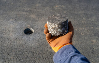 Asphalt core sample illustrating balanced mix design and performance-based asphalt specification testing.